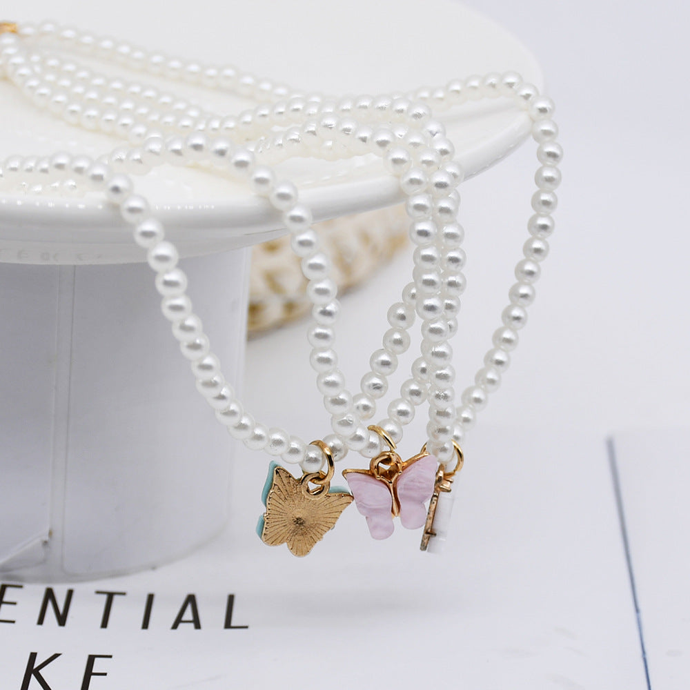 Rozene Pearl Butterfly Choker - Elegant Statement Necklace